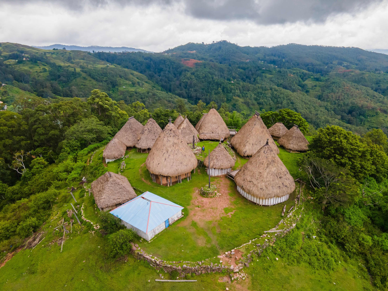 Aerial view of a complex of traditional houses in one of the villages in the Aileu Municipality in Timor Leste