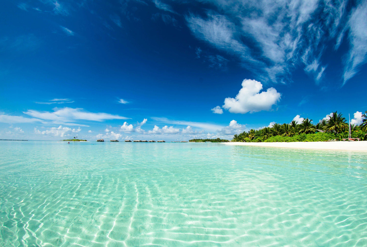 Crystal clear aqua seas around a Fijian island.