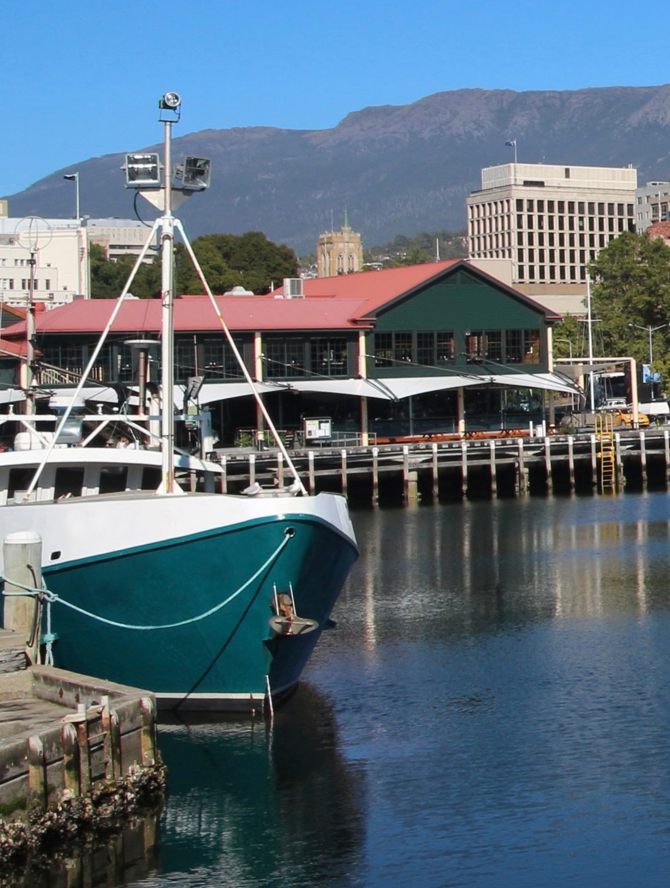 Franklin Wharf in Hobart with a boat moored in the foreground.