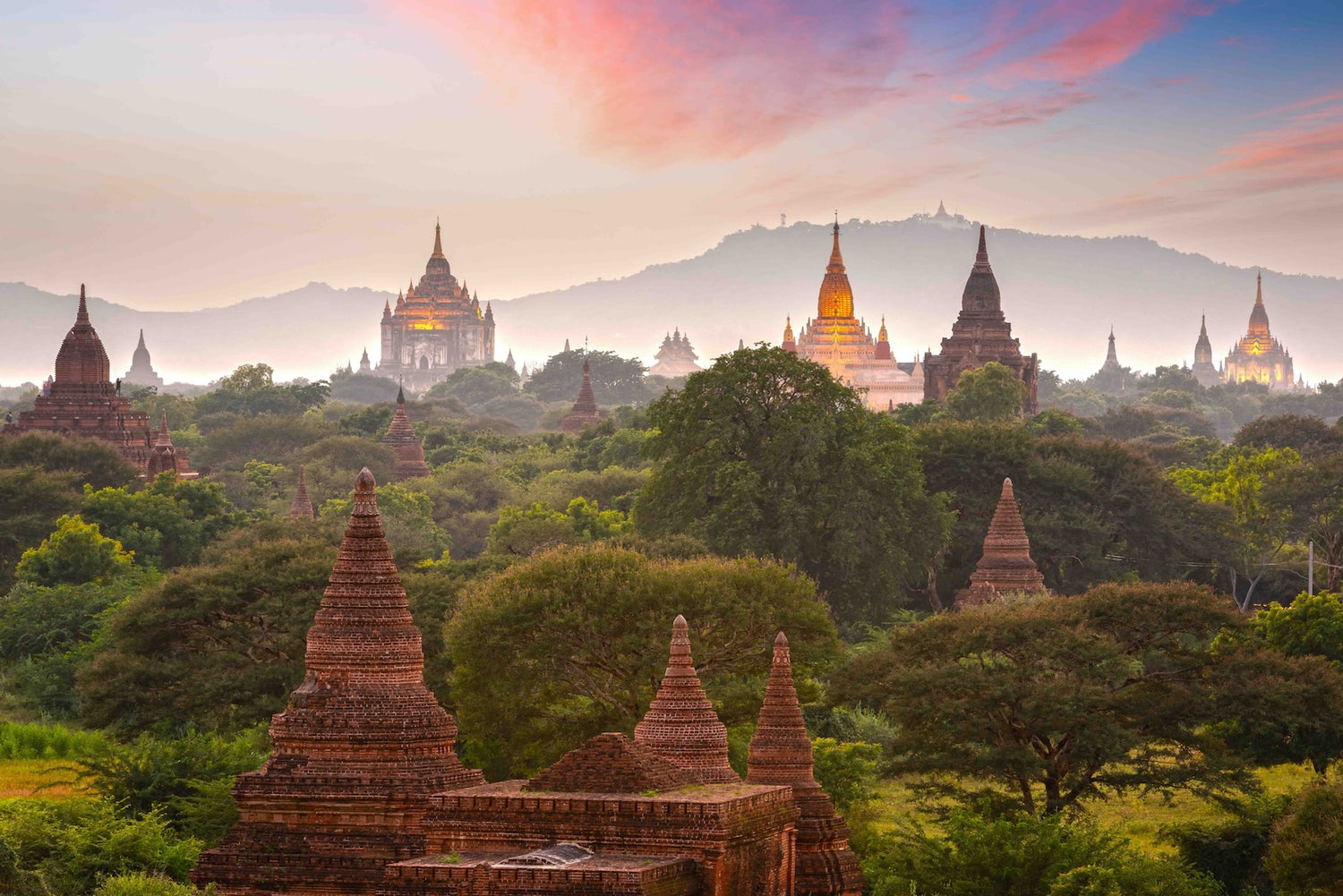 Bagan, Myanmar temples in the Archaeological Zone at dusk.