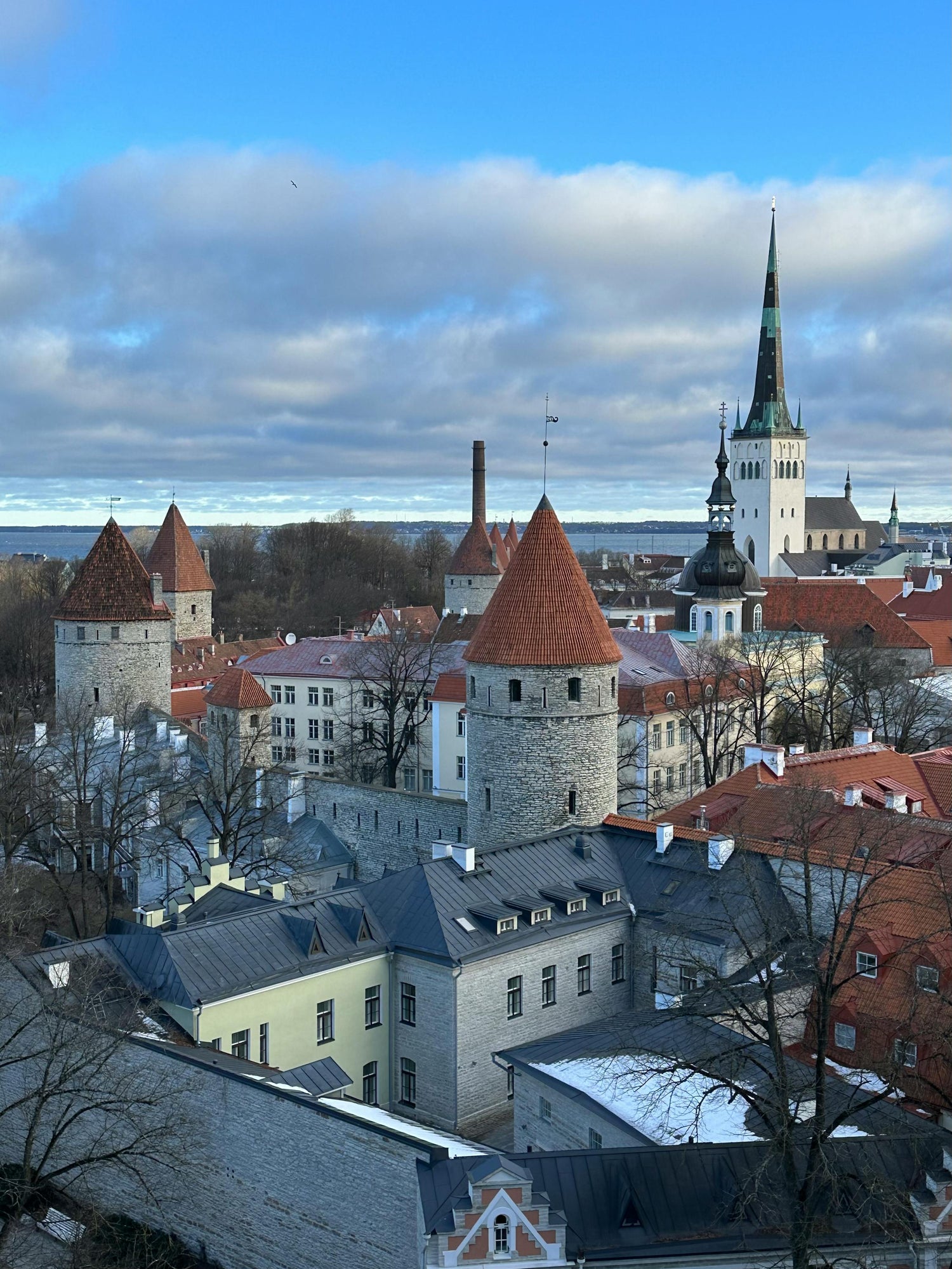 Tallinn Old Town in Estonia with historical buildings and a blue sky.