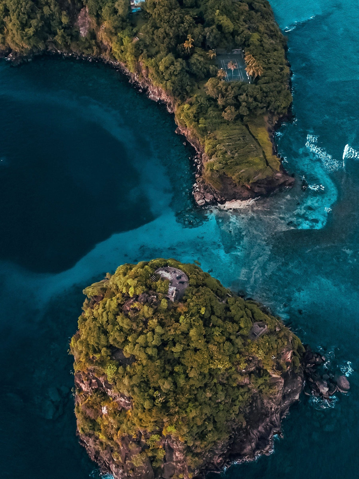 Picture of Saint Vincent and the Grenadines featuring rocky lush islands and coastline on dark blue waters