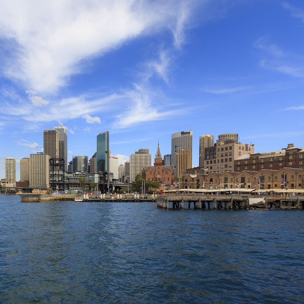 City skyline with modern and historic buildings along the waterfront in Townsville, Australia.