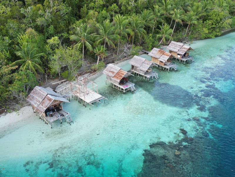 Rustic overwater bungalows in Papua New Guinea.